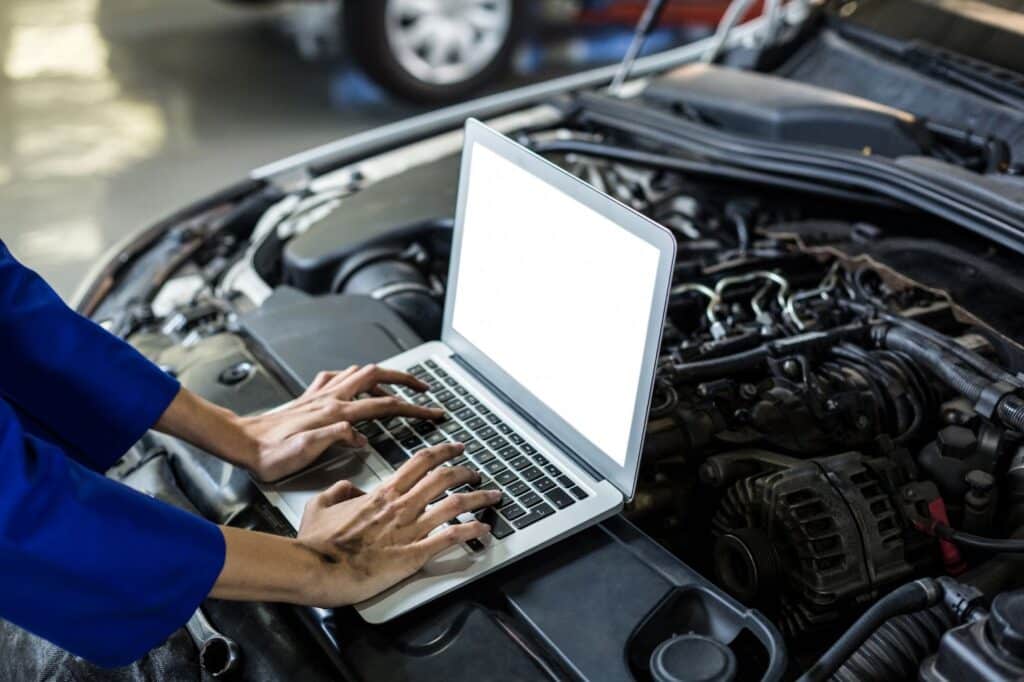 laptop being used to diagnose car issues