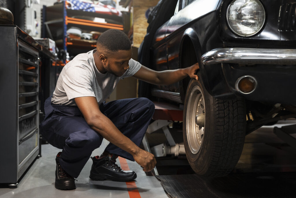 mechanic working on a tire wheel