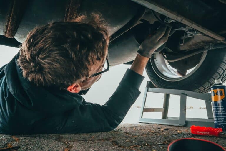 mechanic performing car maintenance