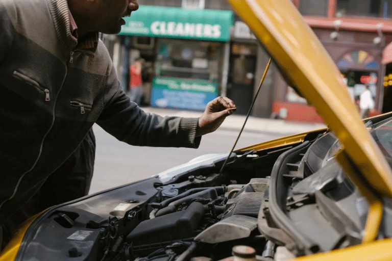 mechanic performing safety check on a vehicle