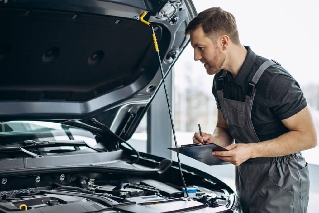 Mechanic inspecting a car