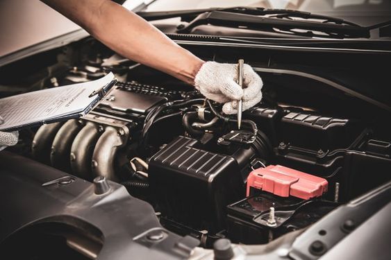 Man inspecting car