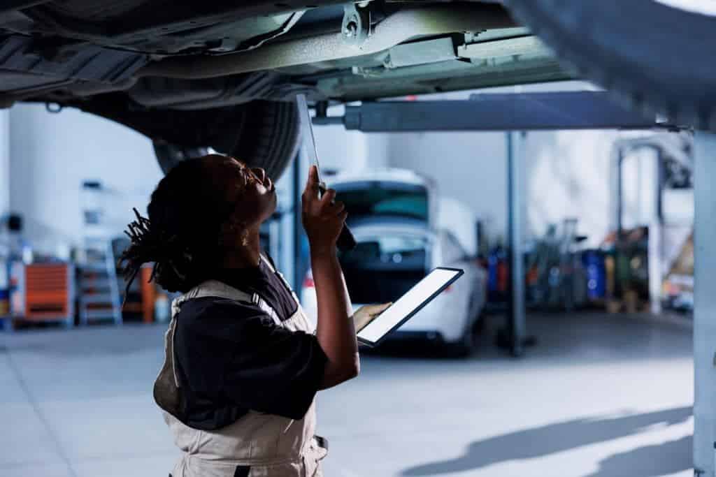 An image of a lady inspecting a car