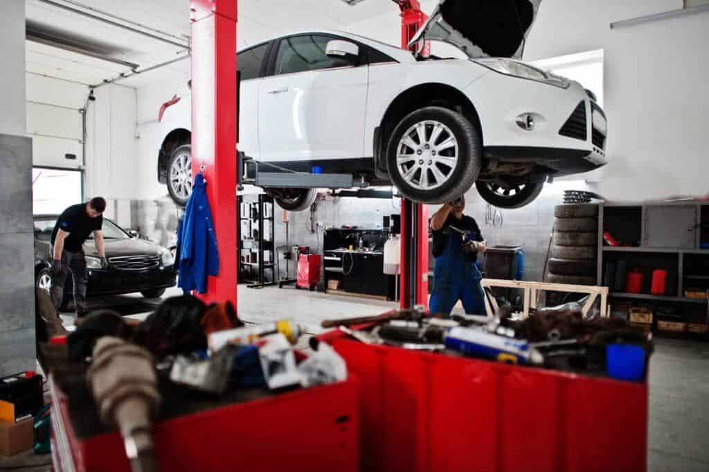 A car undergoing maintenance at an auto repair shop